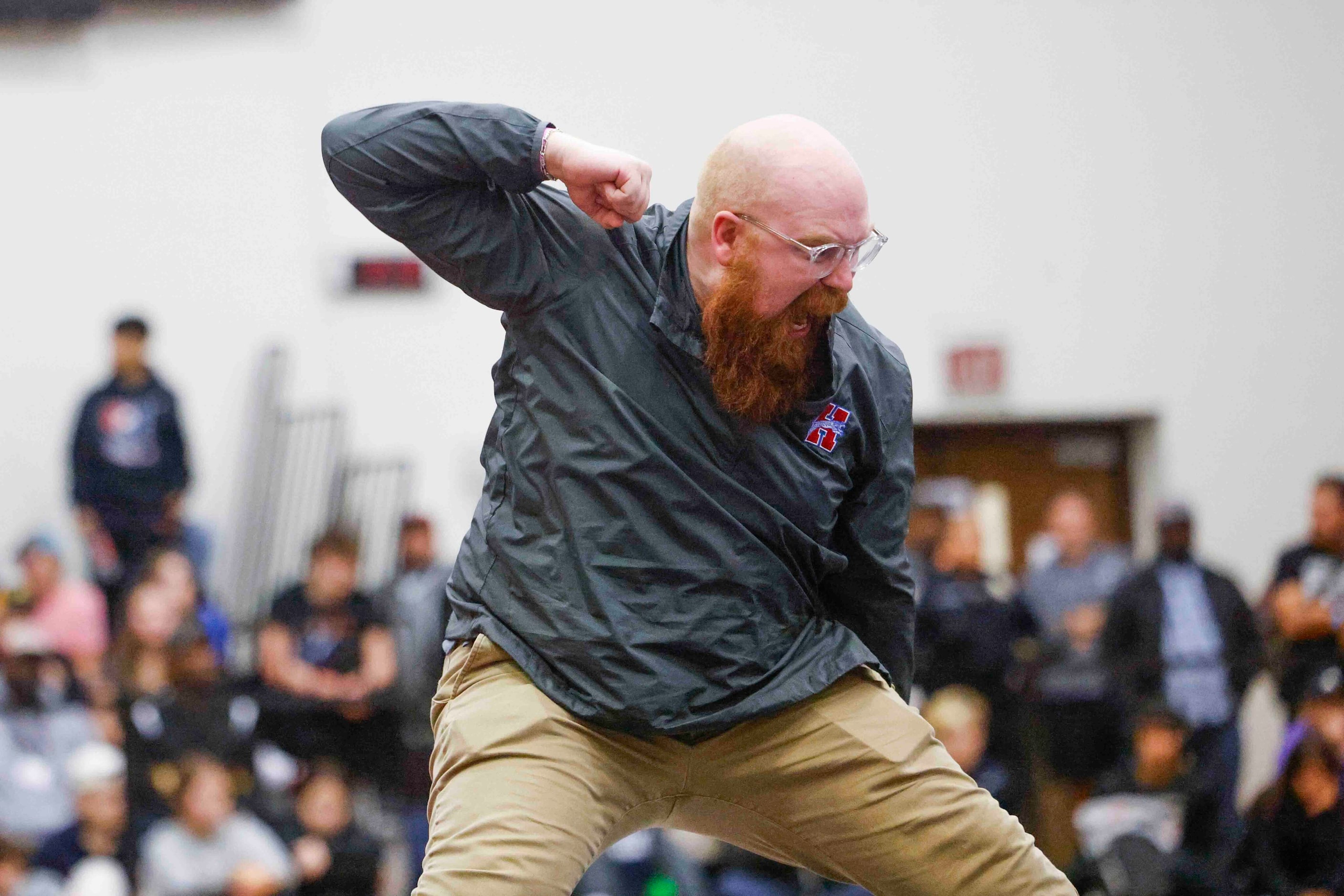 Colling Stroner head coach of Midlothian Heritage cheer Eve Smith’s victory against Layla...