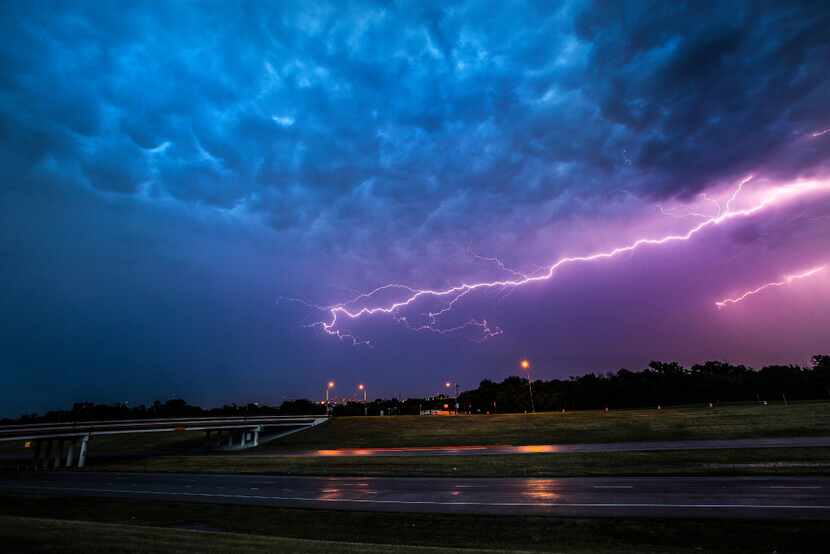 In this June file photo, lightning fills the sky over State Highway 360 near Euless.