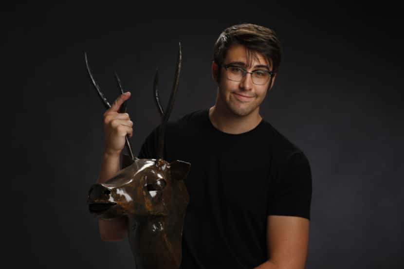 Blacksmith and metal artist Russ Connell, with his piece called "Deer Bust."