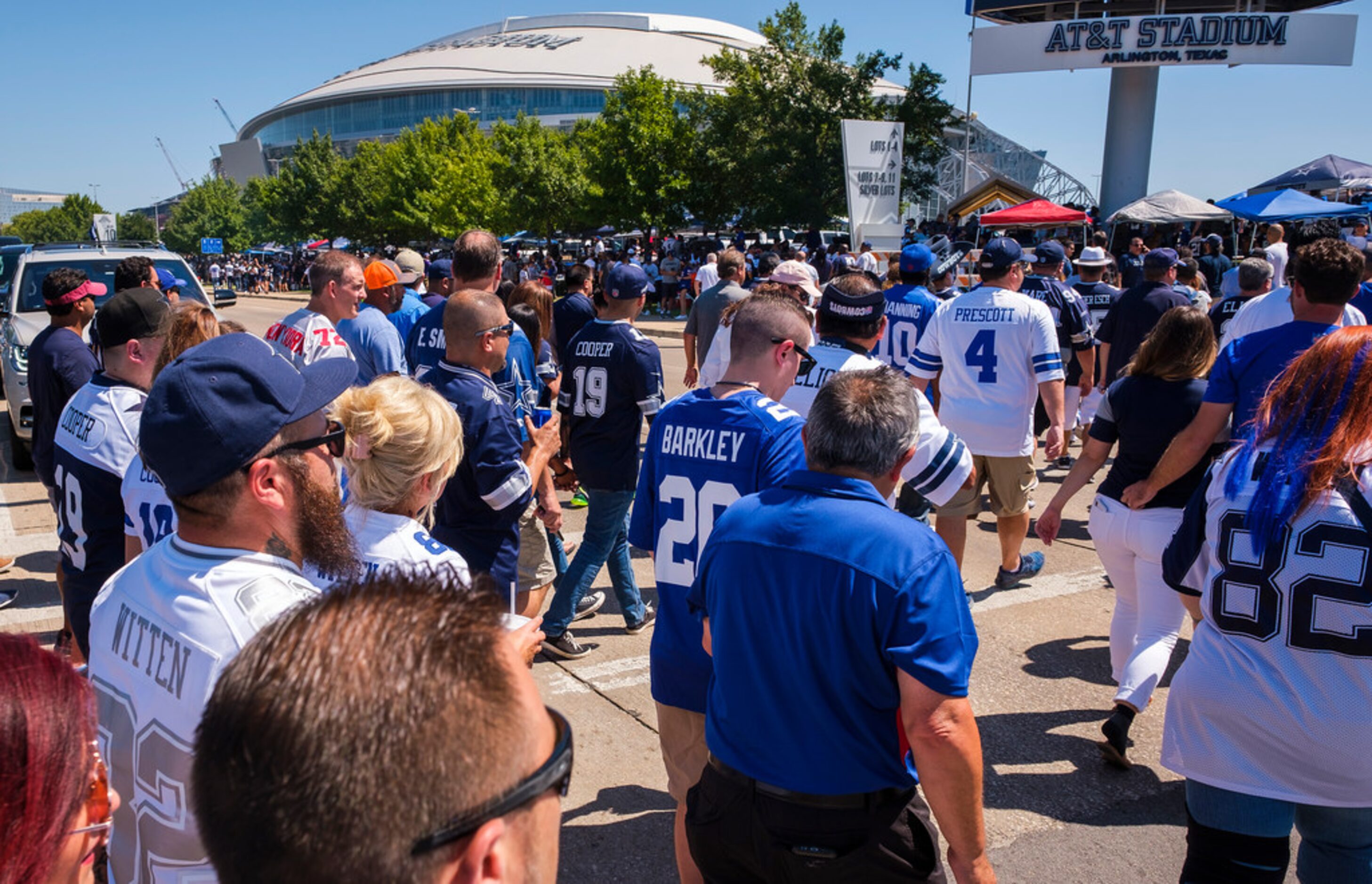 Fans head for the stadium before an NFL football game between the Dallas Cowboys and the New...