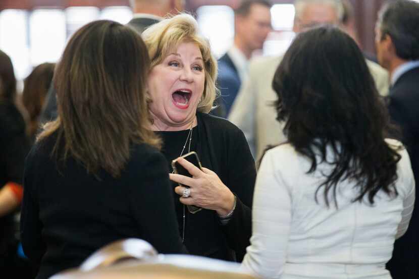 Senator Jane Nelson, center, is greeted by representatives during a joint session in the...