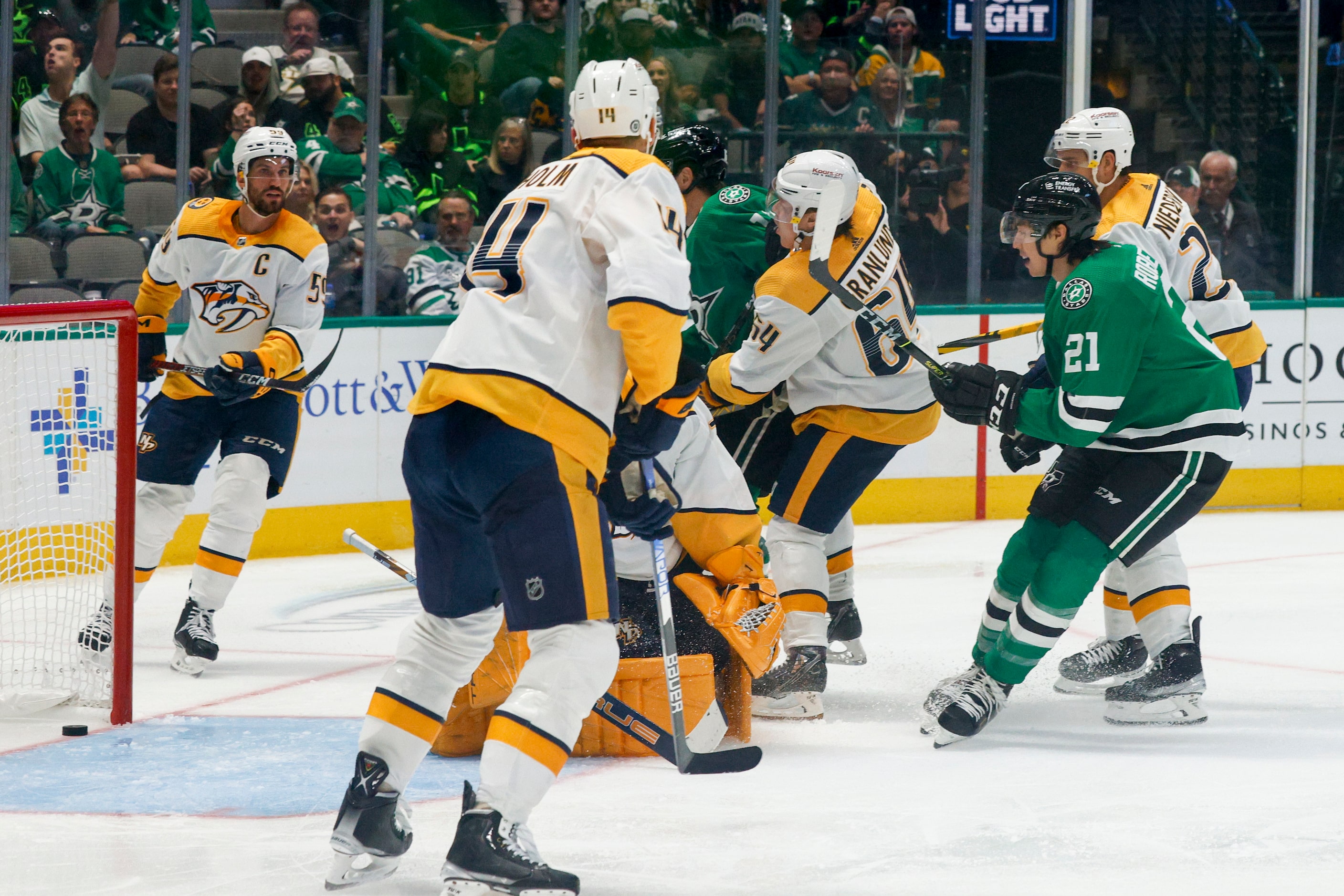 Dallas Stars left wing Jason Robertson (21) scores a past Nashville Predators goaltender...