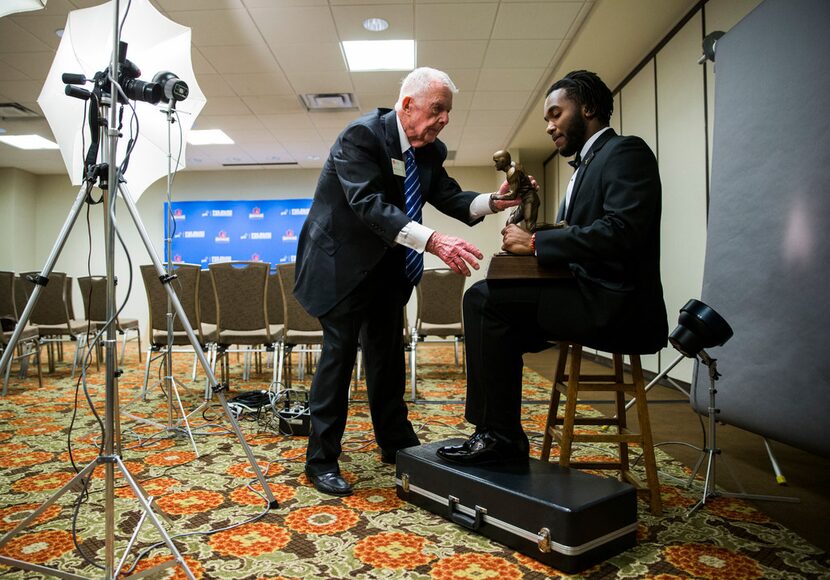 Bryce Love of Stanford University was photographed by Brad Bradley (left) before he received...