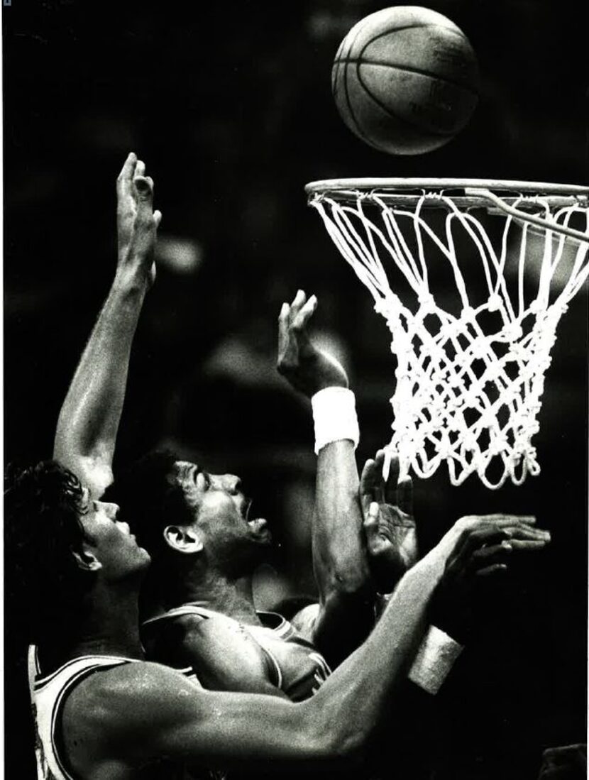 Mavericks center Tom LaGarde battles San Diego Clippers forward Sidney Wicks for a rebound...