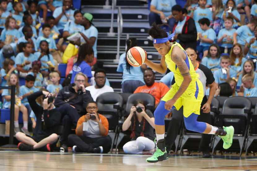Dallas Wings forward Glory Johnson (25) dribbles with authority as she sets up an offensive...
