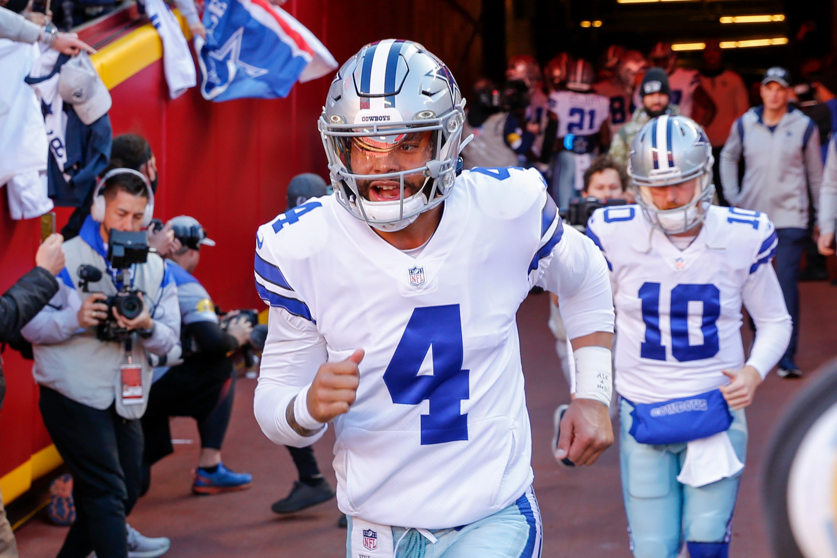 Dallas Cowboys quarterback Dak Prescott (4) runs onto the field before the first half of an...