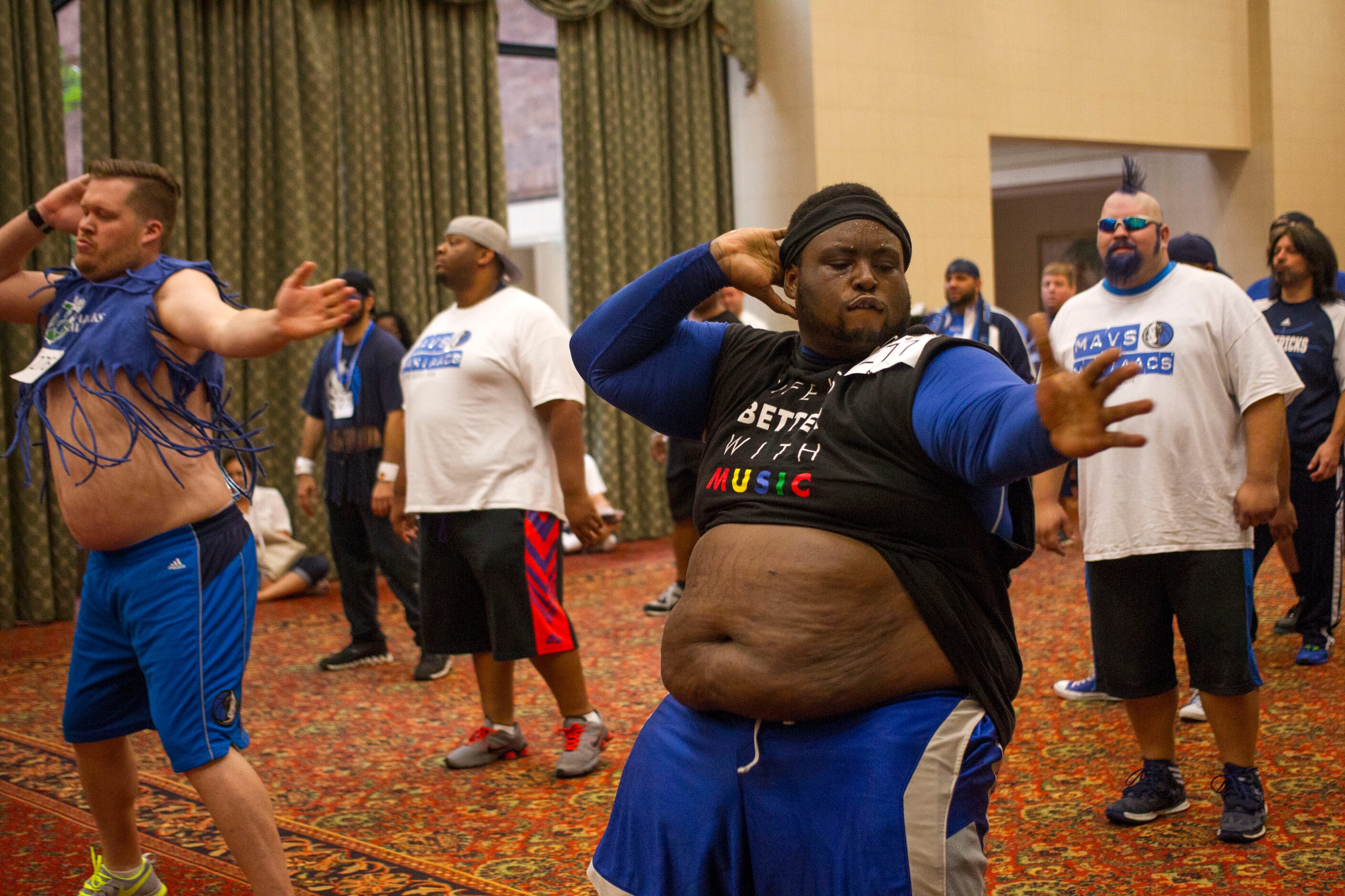 Ryan Walker, left, and Major Attaway, right, perform for judges during The Mavs ManiAACs...