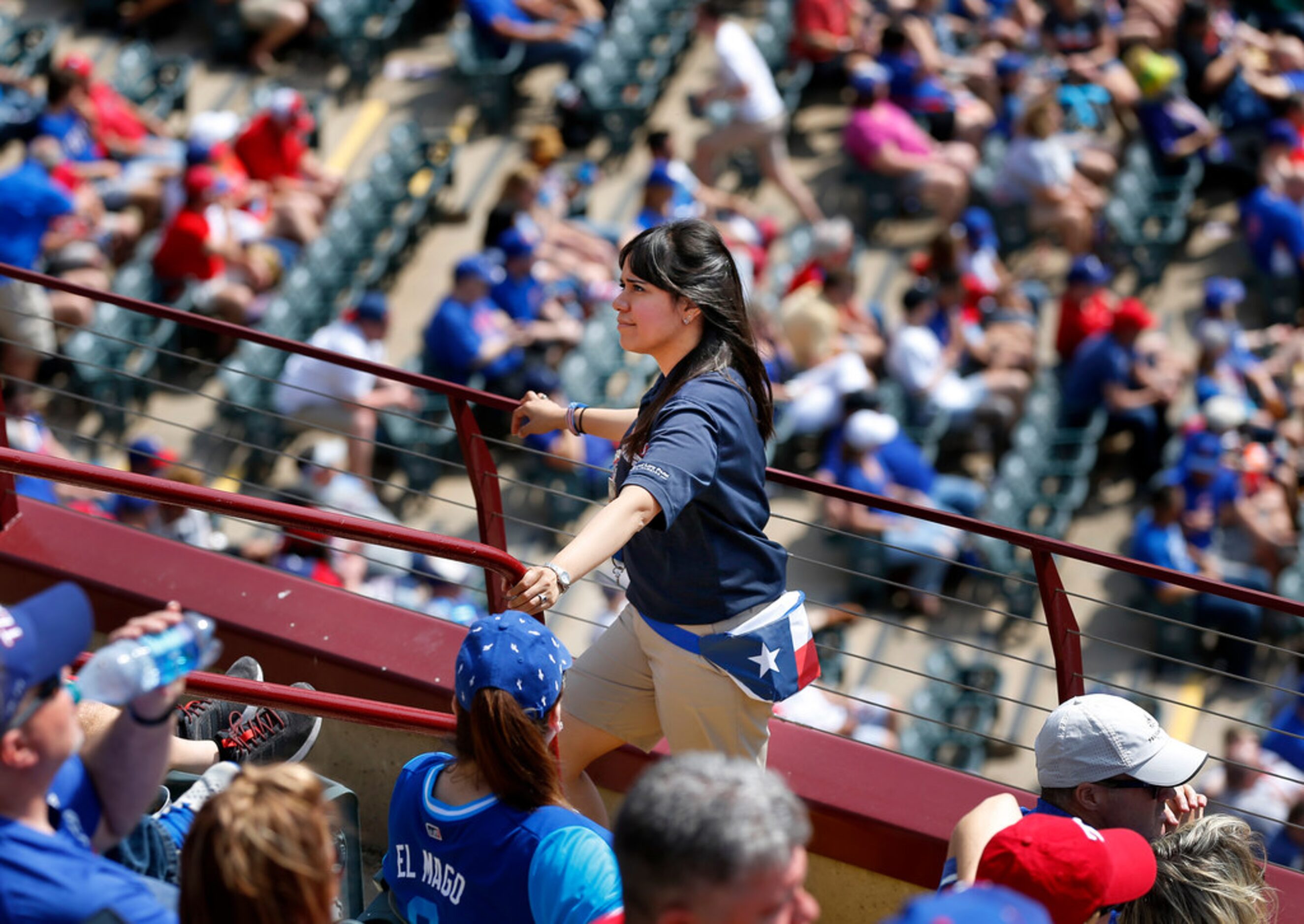 Texas Rangers usher Margarita Aguirre works in Section 209 during Opening Day at Globe Life...