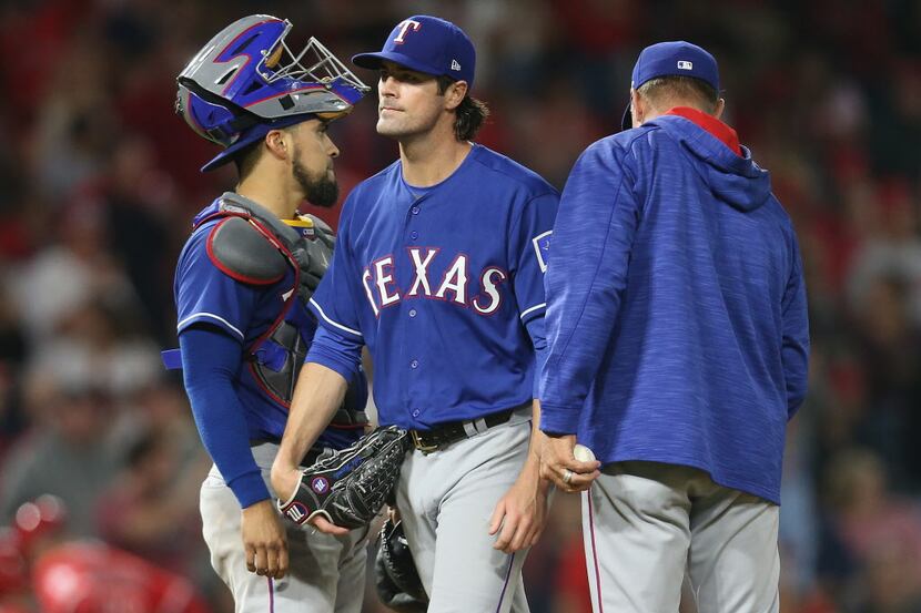 ANAHEIM, CA - SEPTEMBER 16:  Starting pitcher Cole Hamels #35 of the Texas Rangers is...