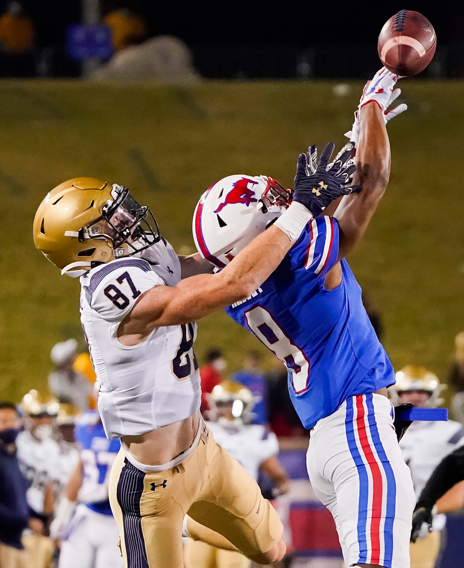 SMU cornerback Bryan Massey (8) breaks up a pass intended for Navy wide receiver Ryan...