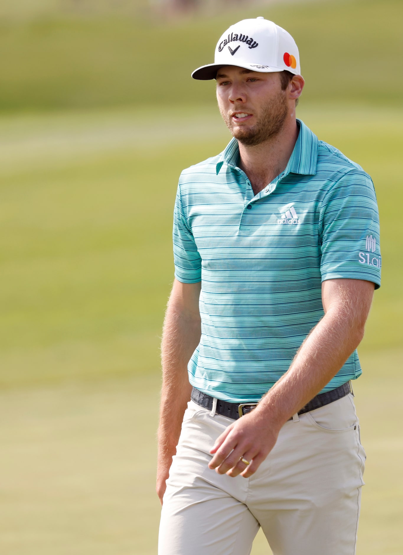 Sam Burns exits the 16th hole green during round 2 of the AT&T Byron Nelson  at TPC Craig...