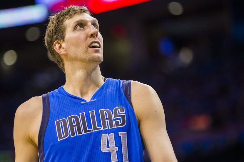 Dallas Mavericks forward Dirk Nowitzki (41) looks up at the scoreboard during the second...