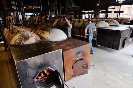 Five big offset smokers are on display at Terry Black's Barbecue in Dallas. Go talk to the...
