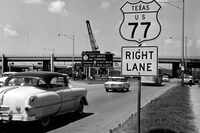 This undated photo shows a sign going up west of Dallas' triple underpass to help sell the...