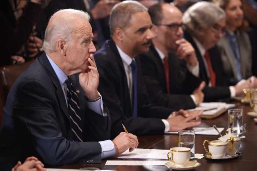 Vice President Joe Biden listens as  President Barack Obama speaks during a recent cabinet...