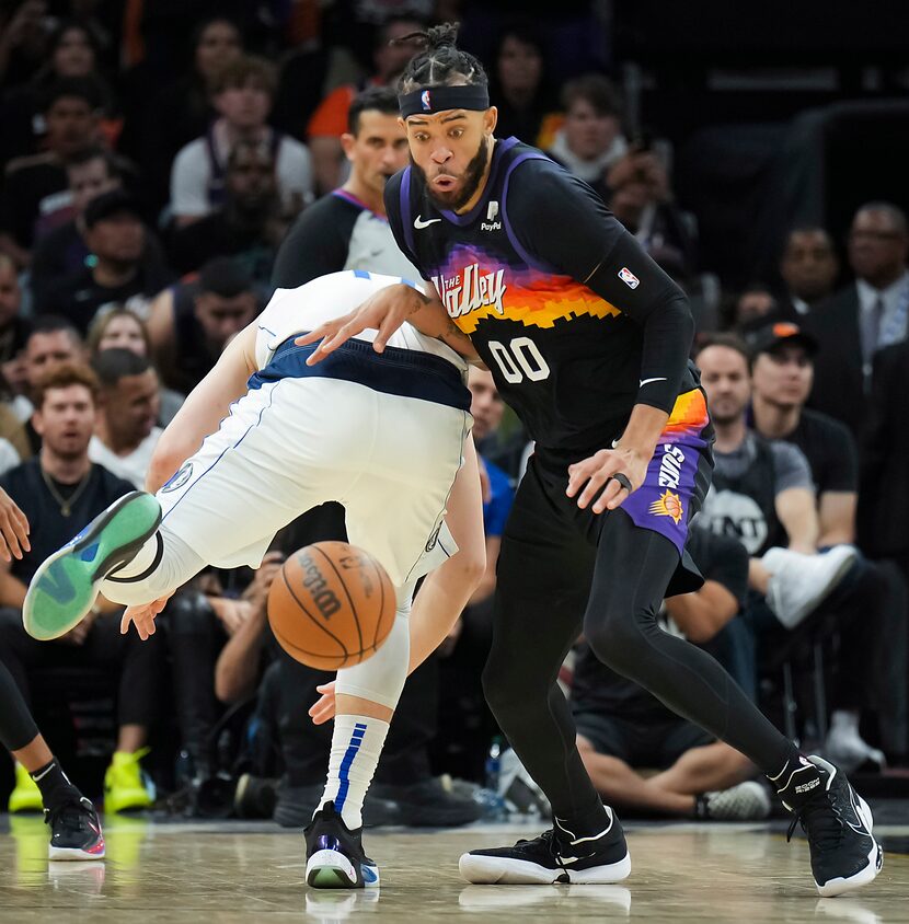 Phoenix Suns center JaVale McGee (00) steals the ball from Dallas Mavericks guard Luka...