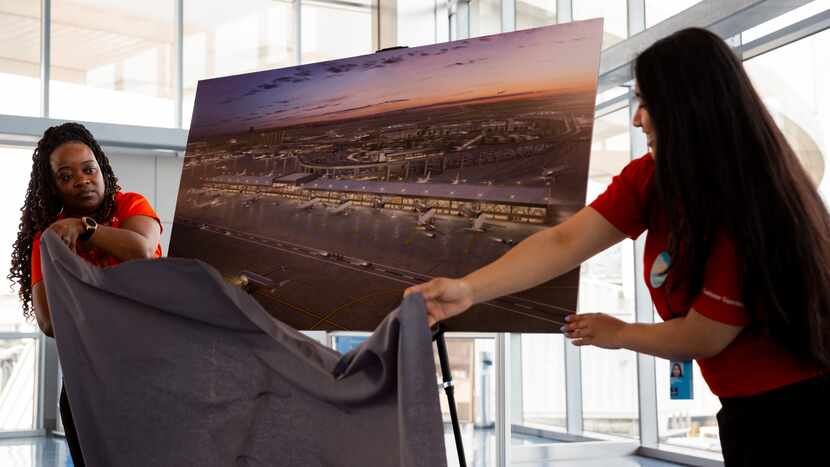 Airport experience specialists Dion Townes (left) and Anjla Shrestha unveil a rendering of...
