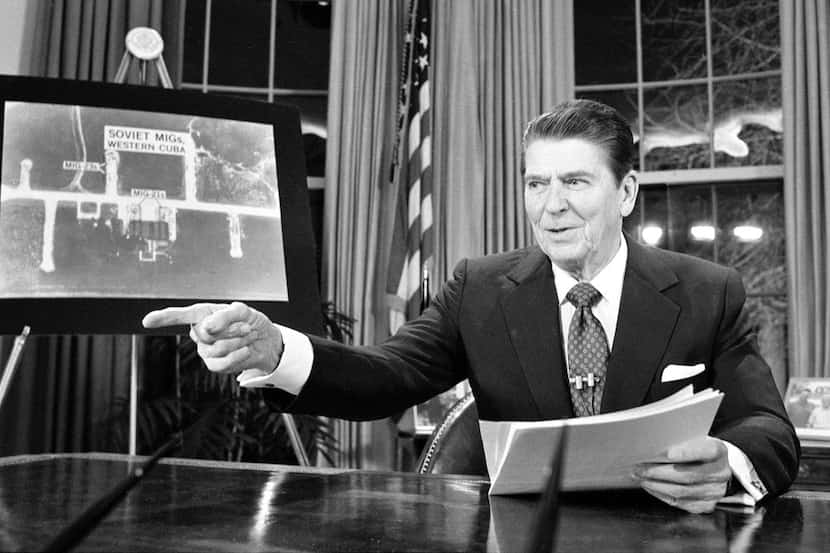President Ronald Reagan points as he addresses the nation on television March 23, 1983, from...