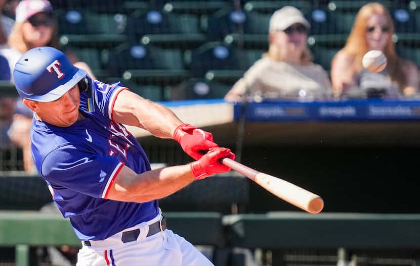 Texas Rangers outfielder Wyatt Langford hits a two-run home run during the third inning of a...