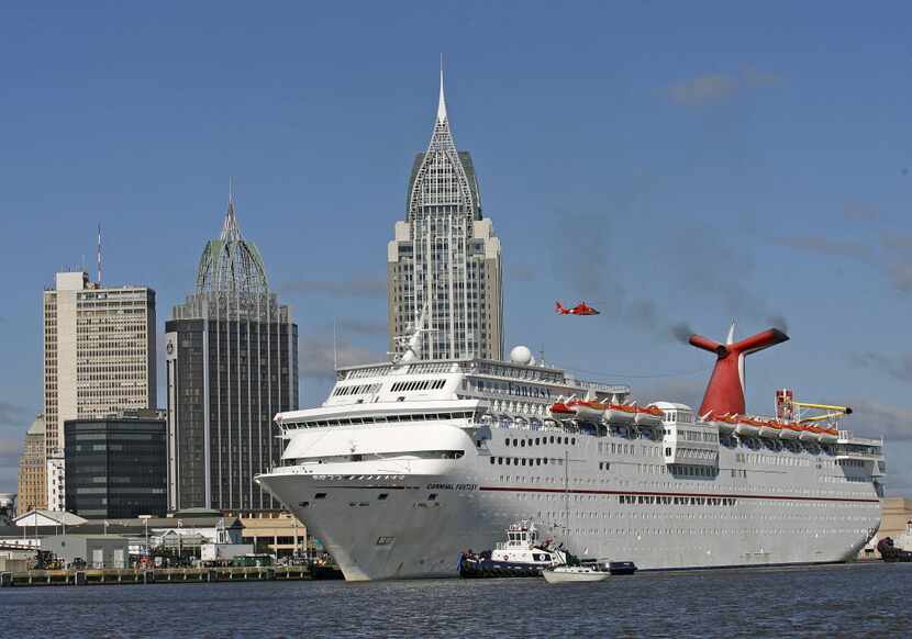 The Carnival Cruise Ship Fantasy moves down the Mobile River on its way to docking at the...