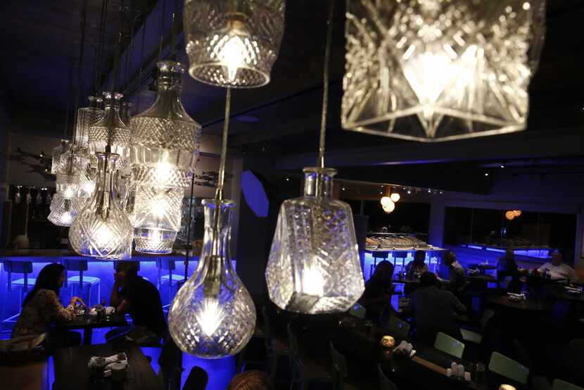 Cut decanters are used as lamps at Lovers Seafood and Marke.