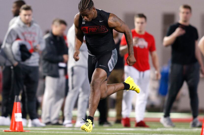 Wide receiver Noah Brown runs the 40 yard dash during football Pro Day at Ohio State...