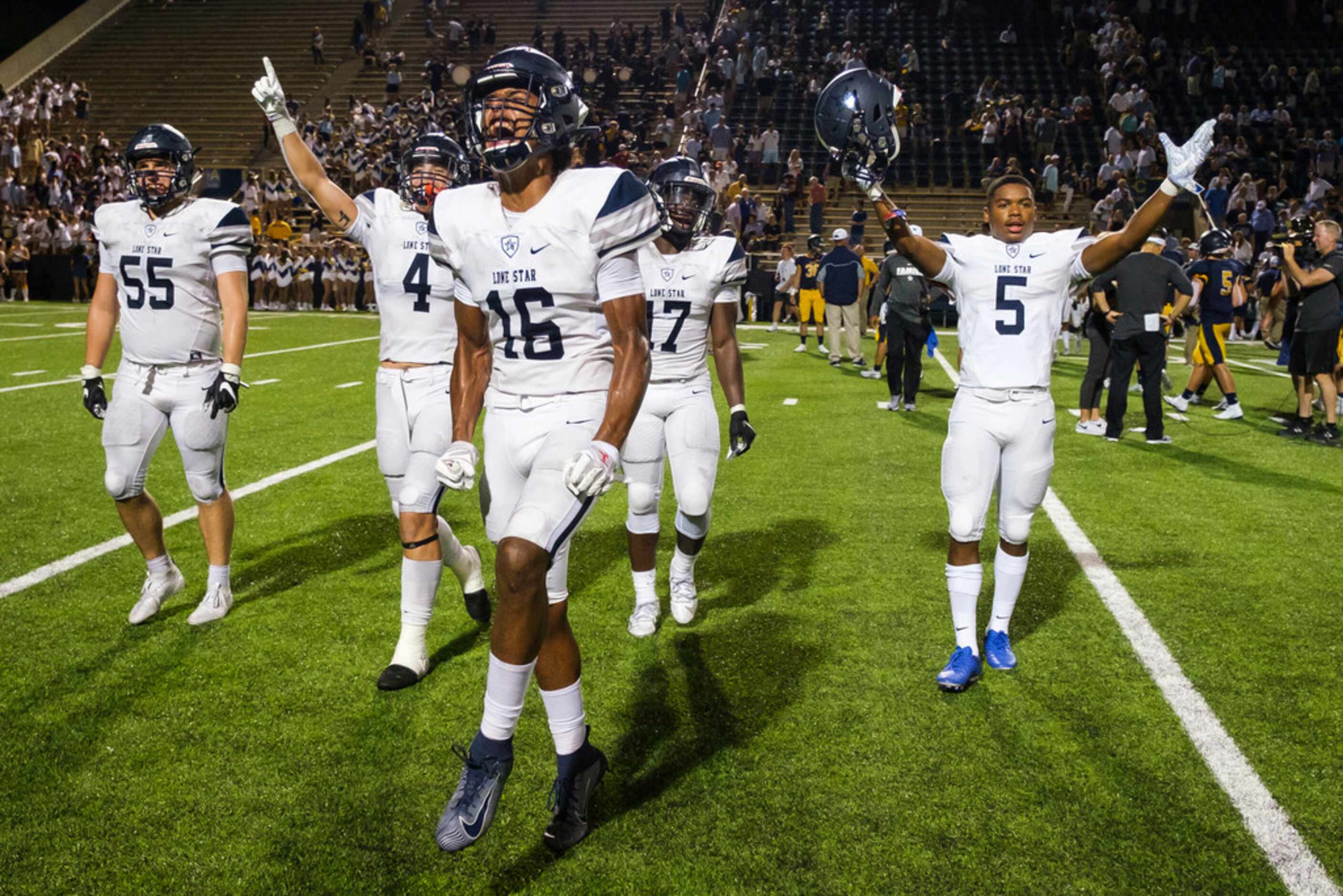 Frisco Lone Star cornerback Sherman Steptoe (16) celebrates with offensive lineman Braden...