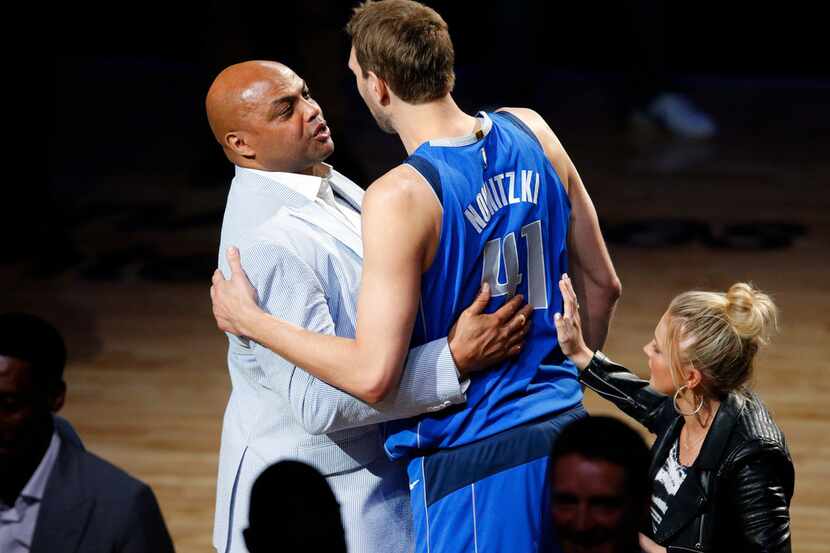 Dallas Mavericks forward Dirk Nowitzki is honored in a post game ceremony by former Hall of...