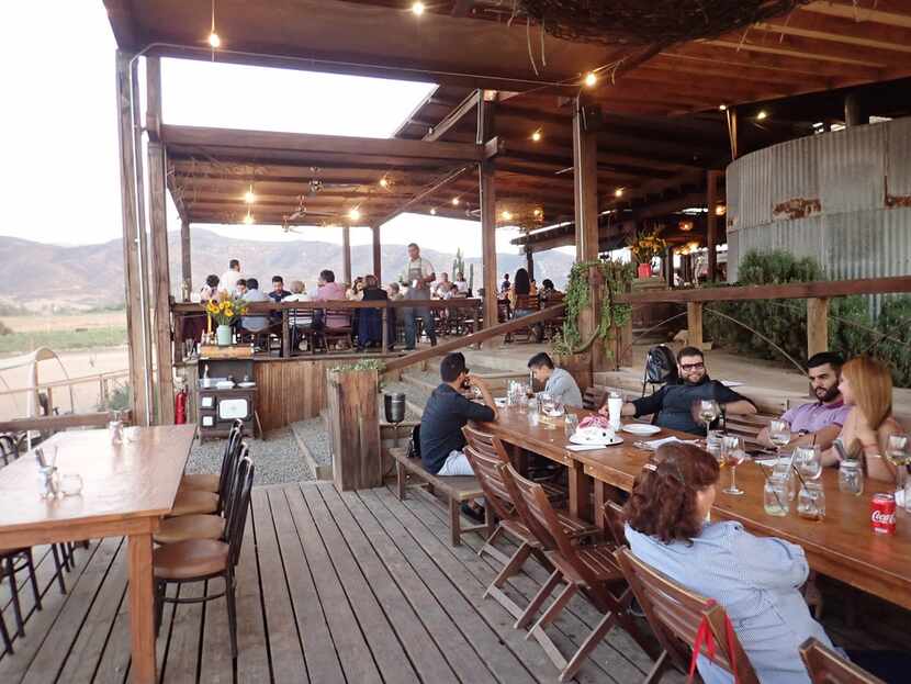 This Oct. 15, 2017 photo shows people dining at the Rustic steakhouse Finca Altozano, which...