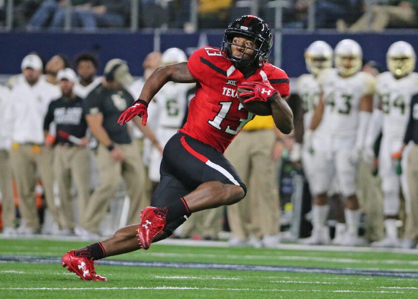 Texas Tech wide receiver Cameron Batson (13) motors downfield after a fourth quarter pass...