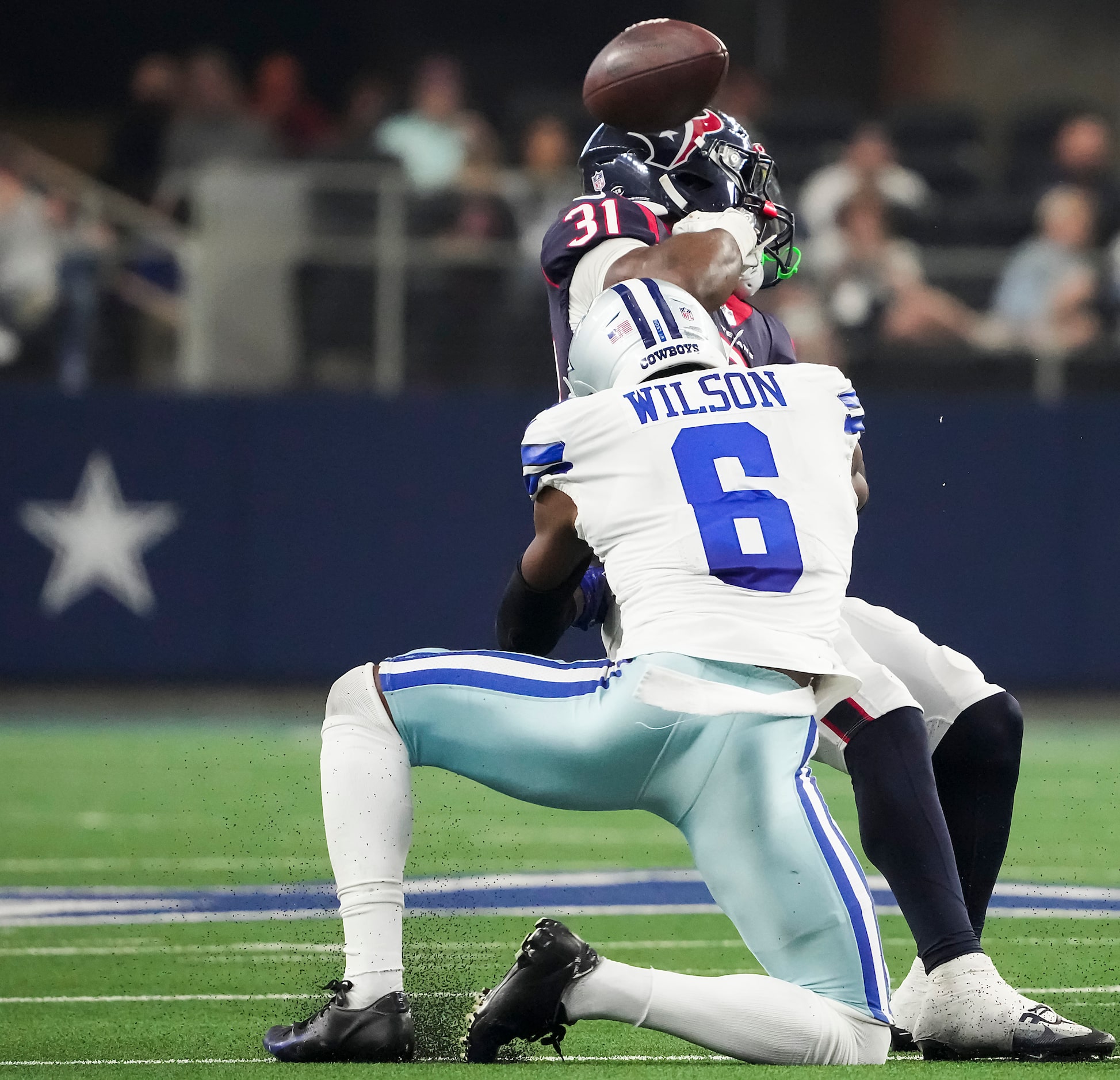 Dallas Cowboys safety Donovan Wilson (6) forces a fumble by Houston Texans running back...