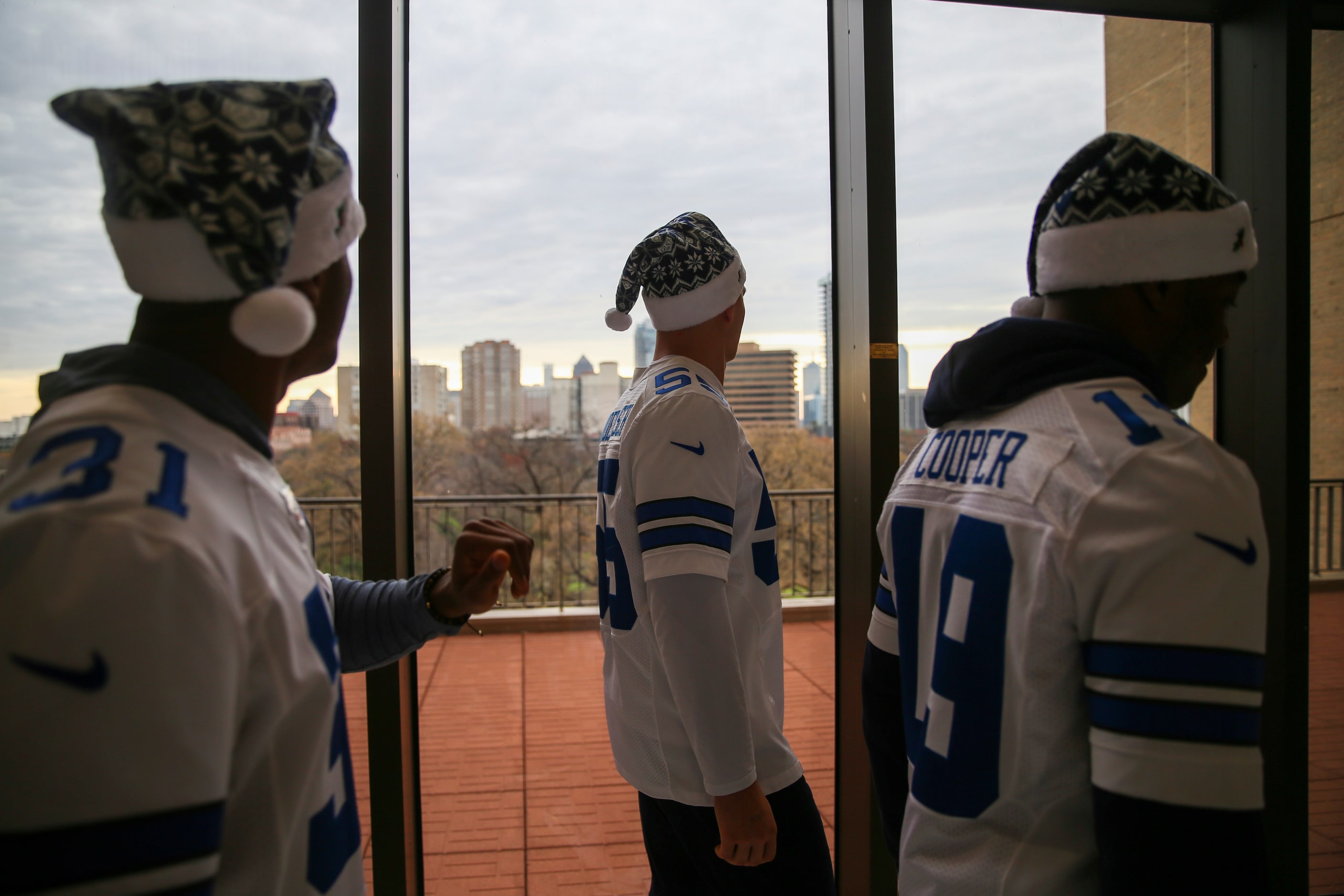 Dallas Cowboys cornerback Byron Jones (31) looks out towards the city along with outside...