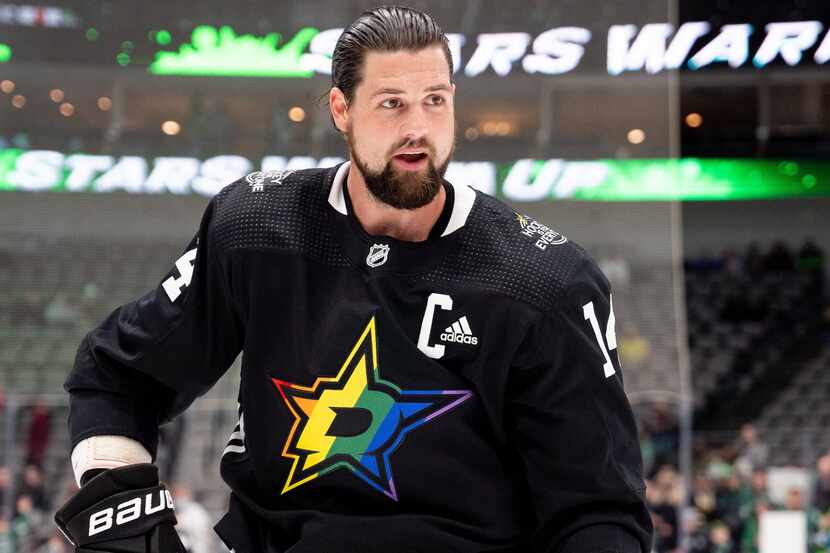 Captain Jamie Benn dons Stars' pride-themed warmup jersey.