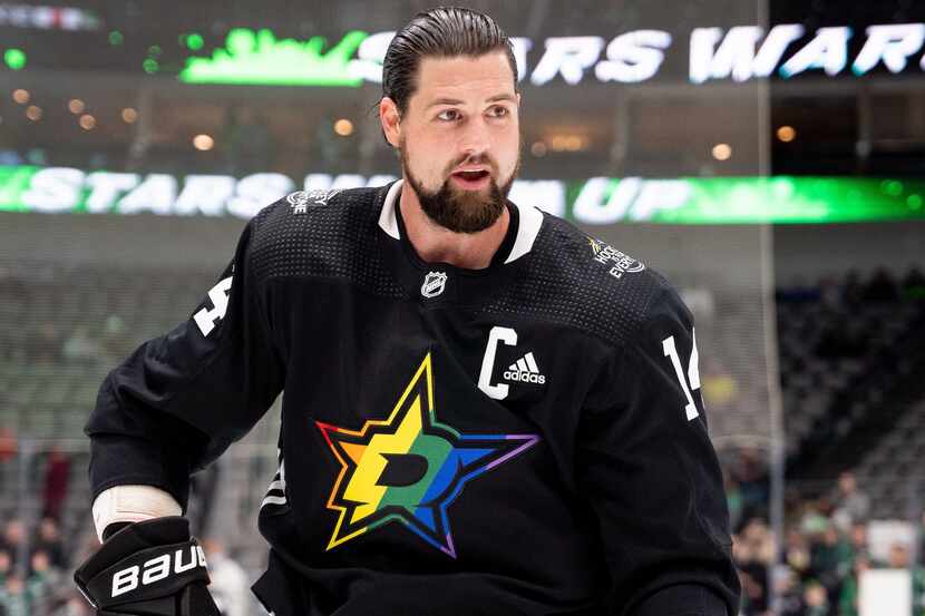 Captain Jamie Benn dons Stars' pride-themed warmup jersey.