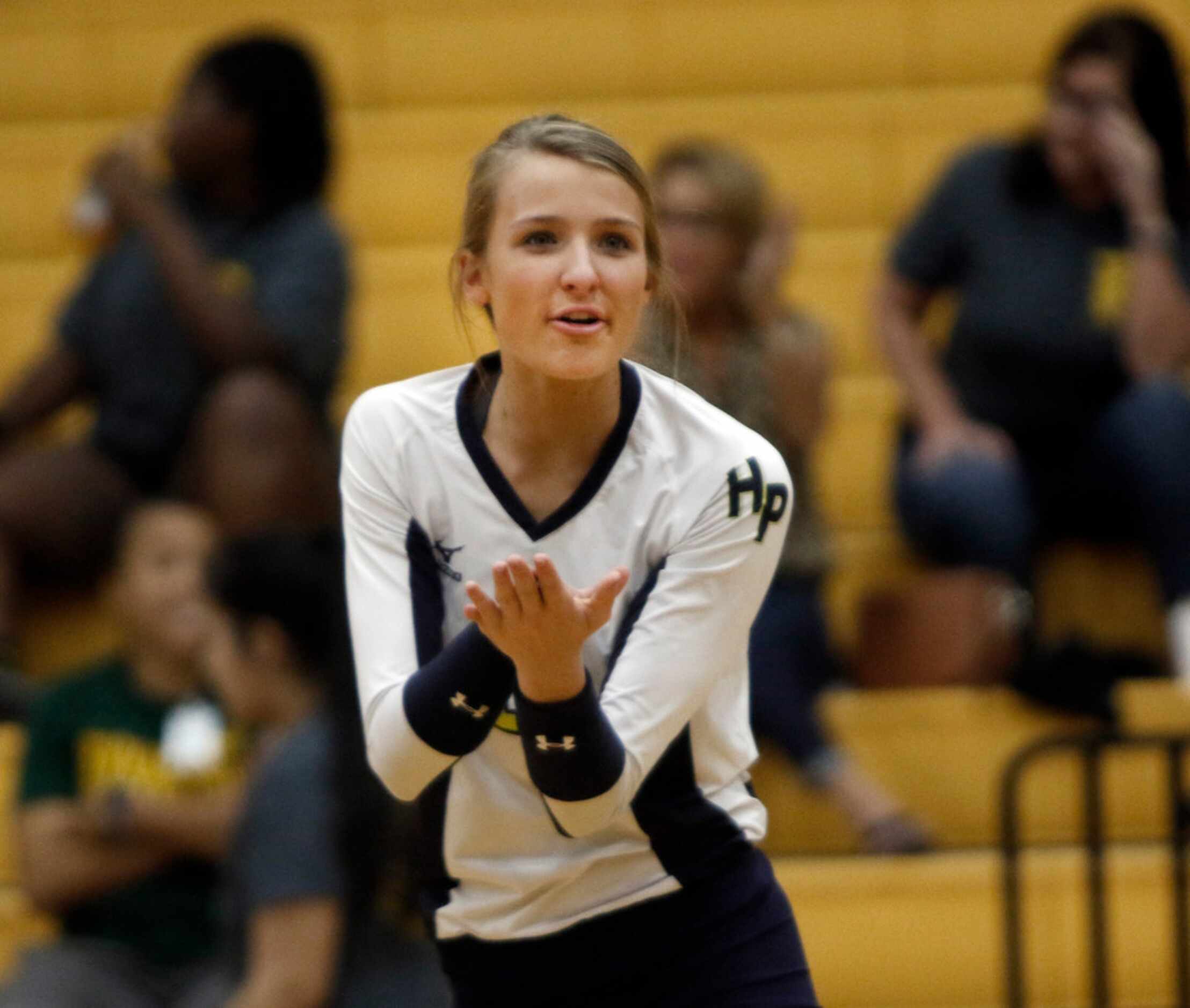 Highland Park outside hitter Kate Nugent (2) encourages teammates during the second set of...