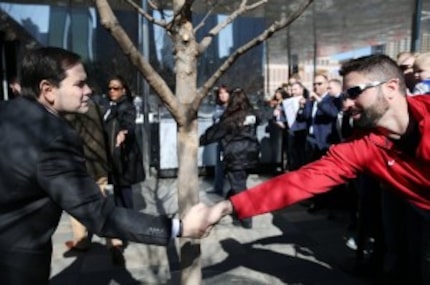  Florida Senator Marco Rubio, a Republican candidate for president, greets a supporter...