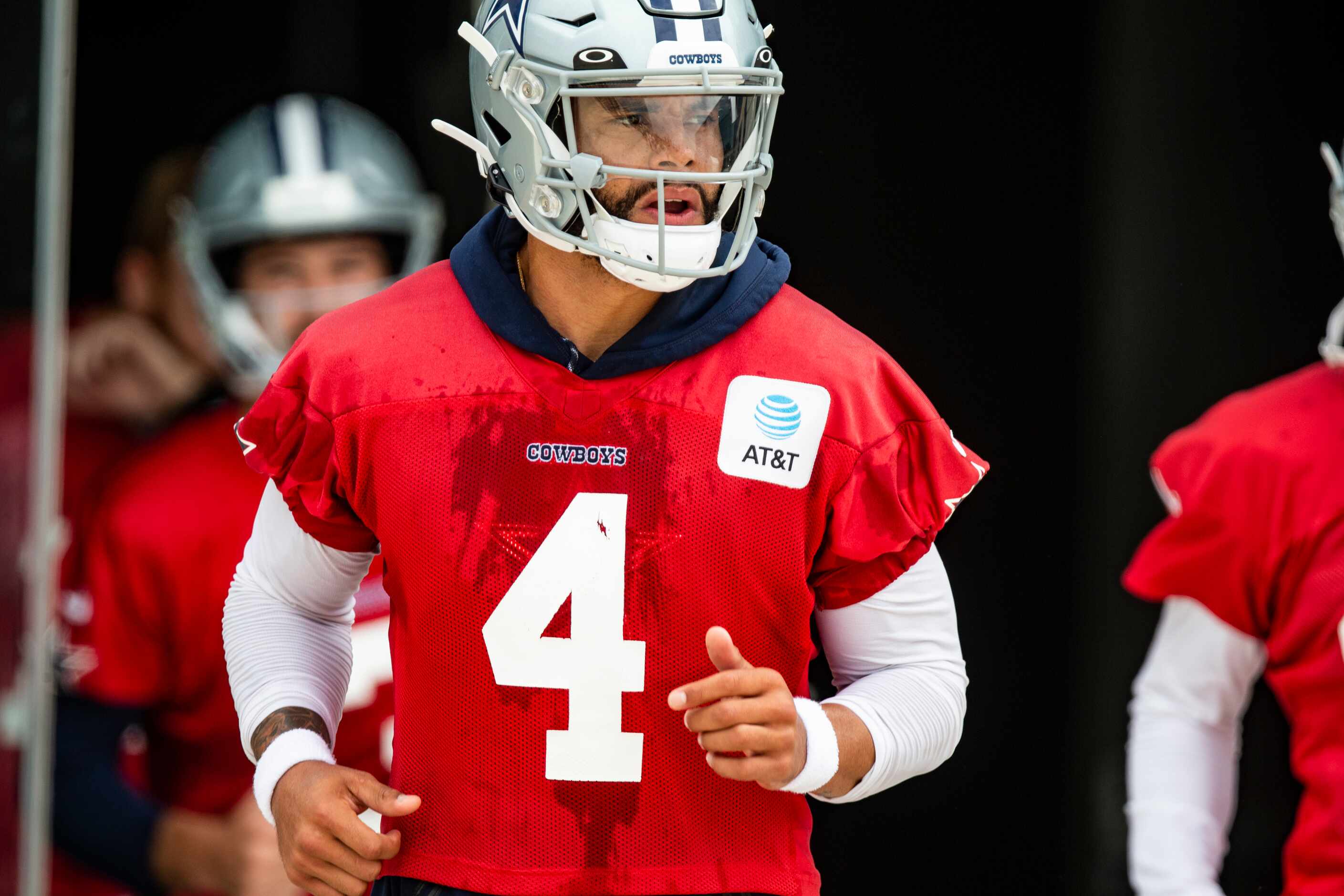 Dallas Cowboys quarterback Dak Prescott (4) runs onto the field during practice at The Star...