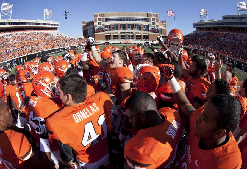 Nov 17, 2012; Stillwater OK, USA; Oklahoma State Cowboys team huddle before the game against...