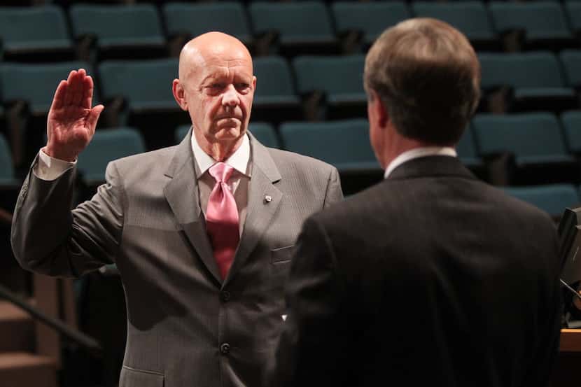Plano Mayor Phil Dyer (right) helped administer the oath of office after Bruce Glasscock was...