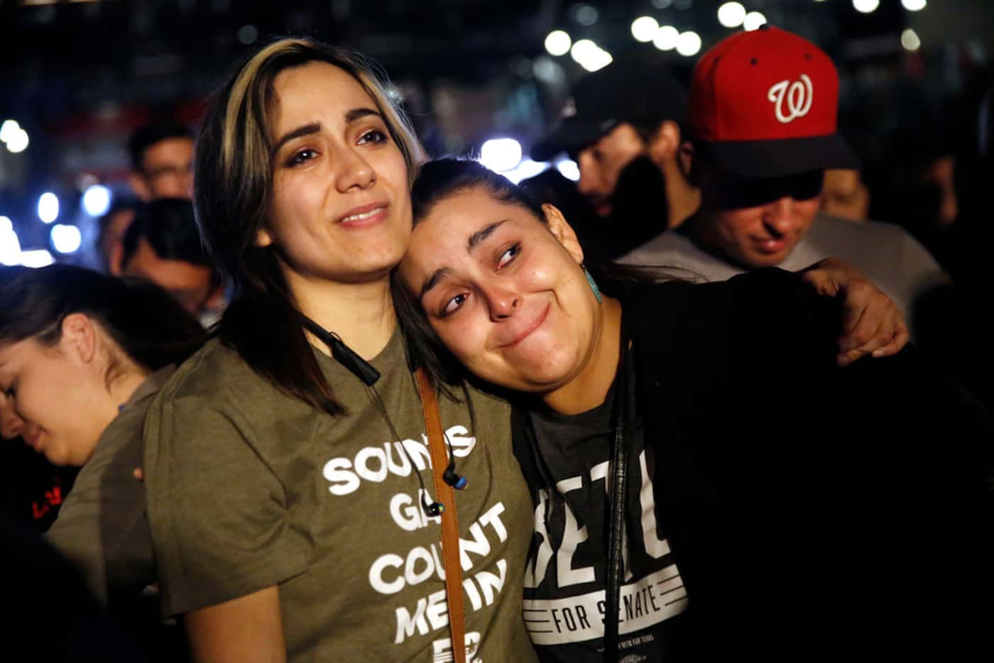 Rio Salazar, left, comforts her friend and Beto volunteer Rebecca Guerreo of El Paso after...