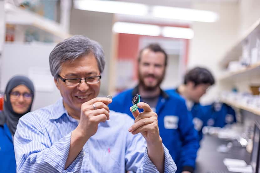 Kyeongjae Cho, professor of materials science and engineering, displays a finished battery...