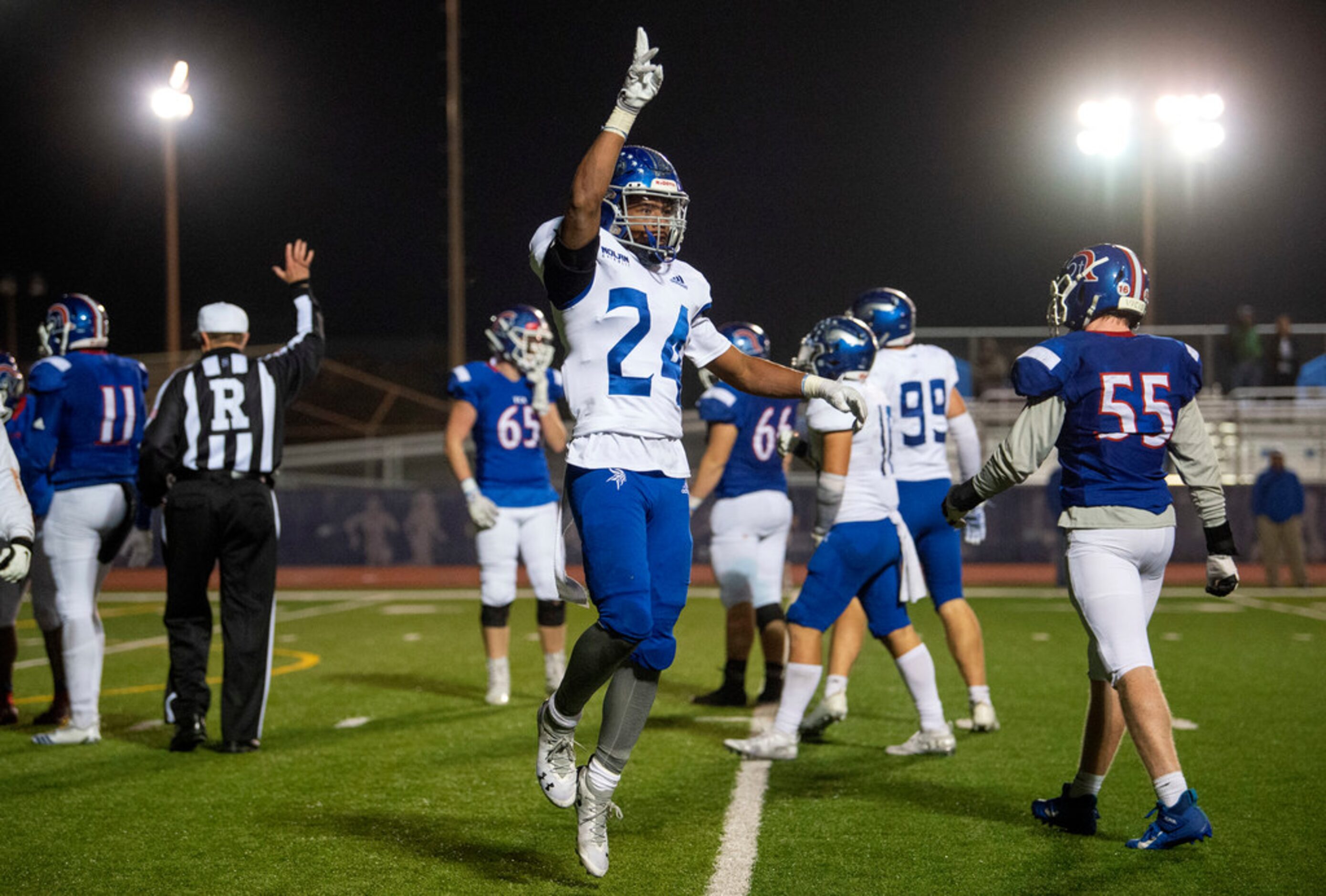 Fort Worth Nolan senior defensive back Jason Kerl (24) celebrates a sack in the second half...