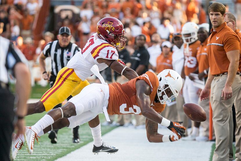 Texas' Armanti Foreman drops the ball on 3rd and long against Iowa State's Kyle Kempt (17)...