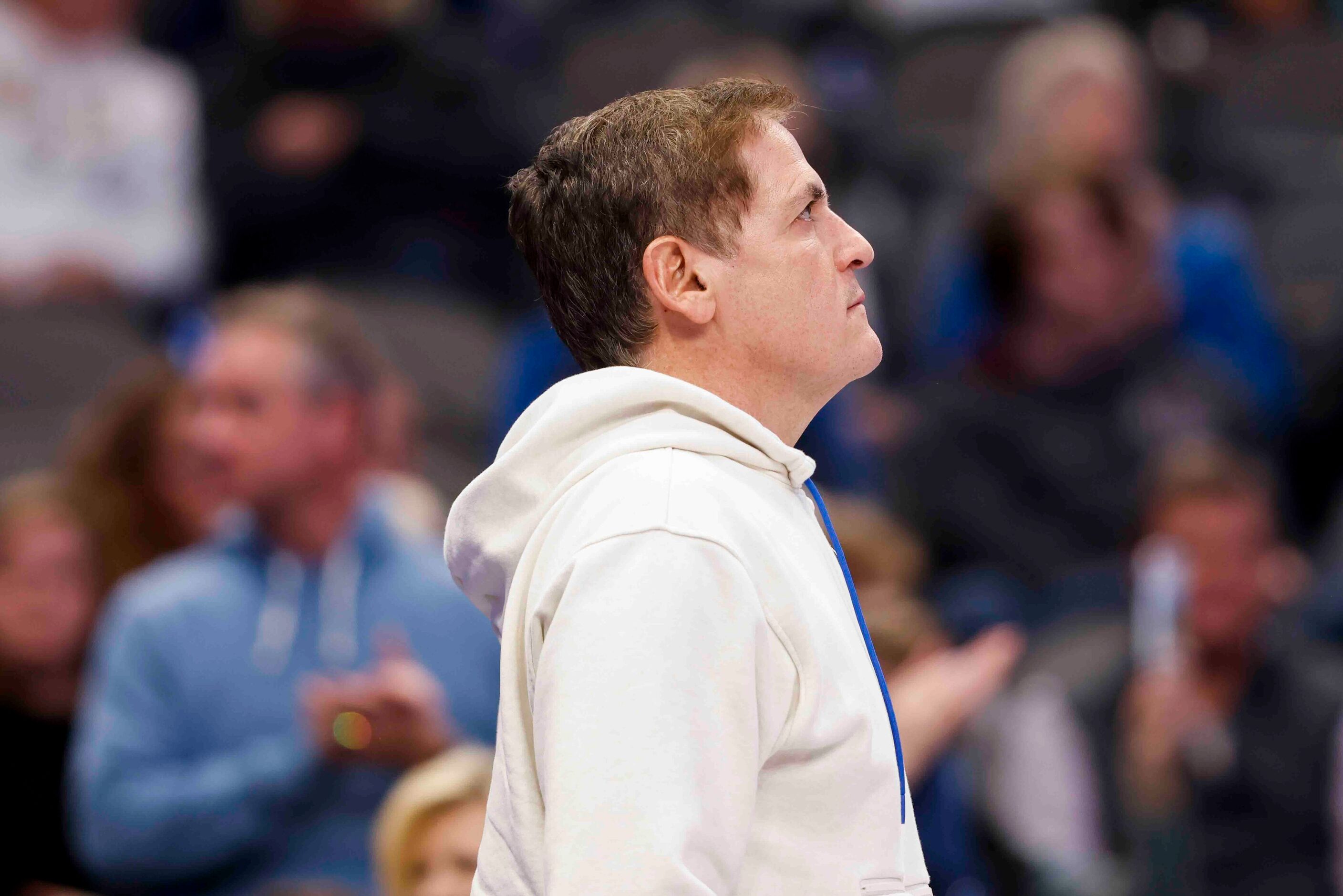 Dallas Mavericks owner Mark Cuban smiles as he leaves after an NBA game against Portland...