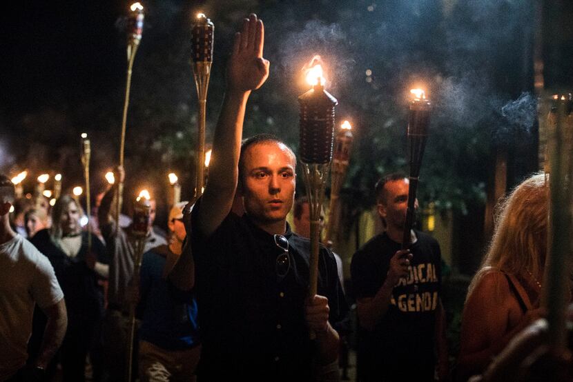 Torch-bearing white supremacists rallied around a statue of Thomas Jefferson near the...
