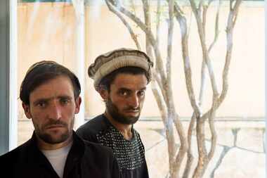  Assadullah, left, who like many Afghans goes by one name, and Abdul Aziz, whose brother...