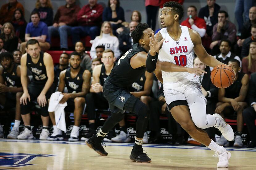 Southern Methodist Mustangs guard Jarrey Foster (10) attempts to get around UCF Knights...