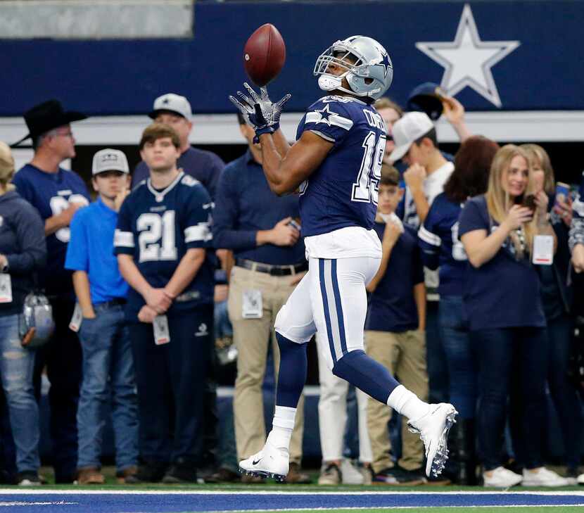 FILE - Cowboys wide receiver Amari Cooper (19) pulls in a pass in the end zone during...
