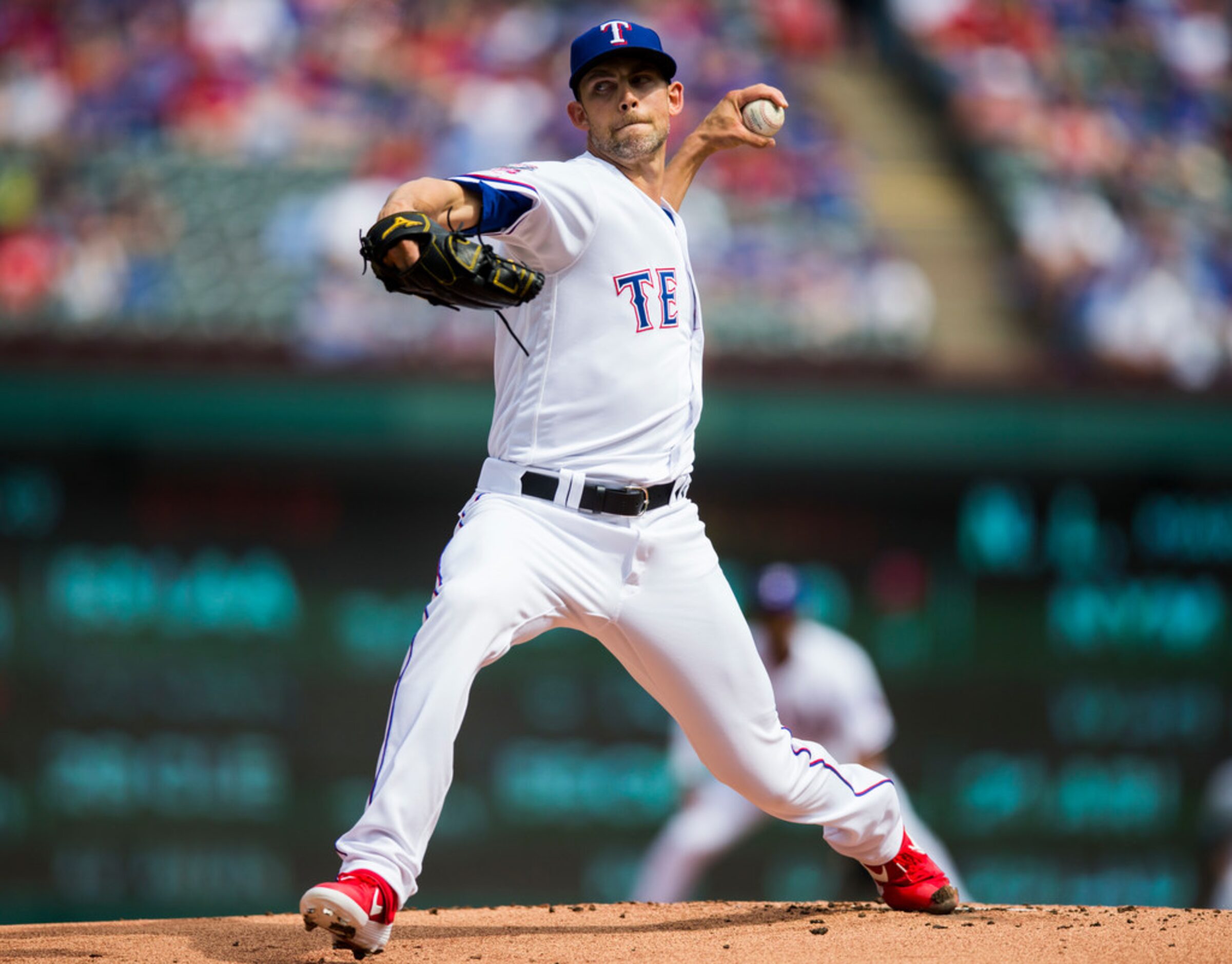 Texas Rangers starting pitcher Mike Minor (23) pitches during the first inning of an opening...