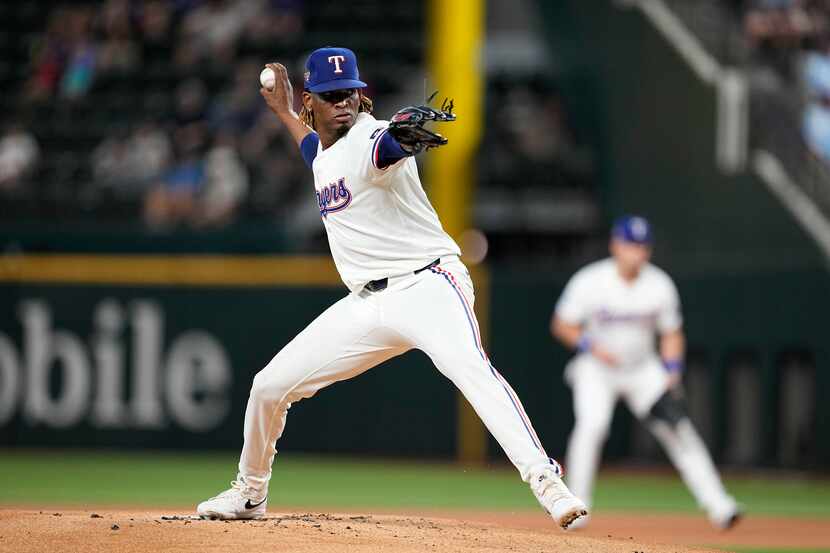 Texas Rangers relief pitcher Jose Urena throws to the Detroit Tigers in the first inning of...
